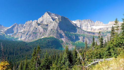 Scenic view of snowcapped mountains against clear sky