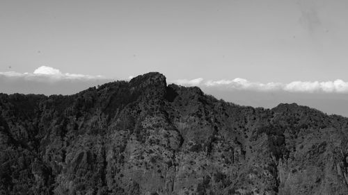 Low angle view of rock formation against sky