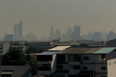 Buildings in city against sky