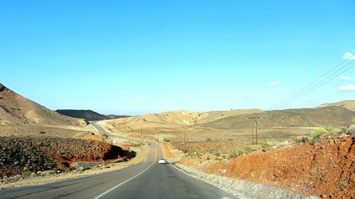 Empty road along landscape