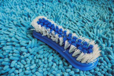 High angle view of brush on rug