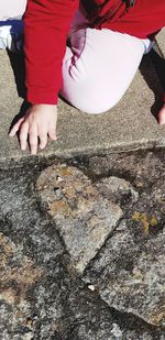 Low section of child on retaining wall