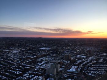 High angle view of buildings against sky during sunset