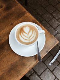 High angle view of cappuccino on table