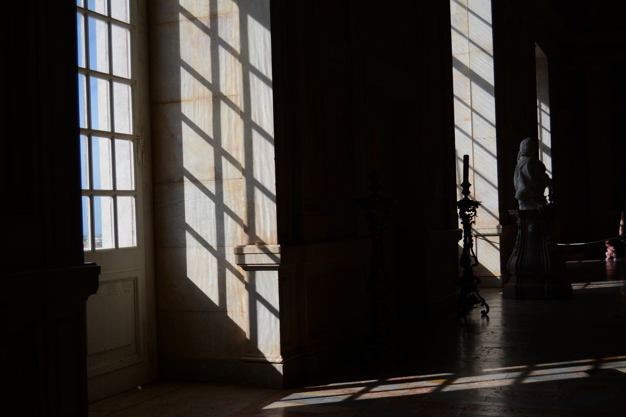 indoors, architecture, built structure, window, door, empty, absence, sunlight, building exterior, building, shadow, flooring, glass - material, closed, day, no people, home interior, entrance, corridor, wall - building feature