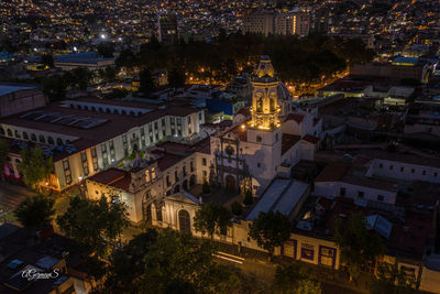 High angle view of illuminated buildings at night