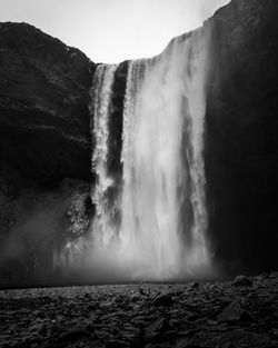 View of waterfall against clear sky