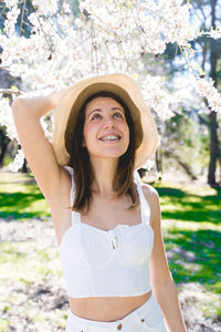 Portrait of young woman wearing hat