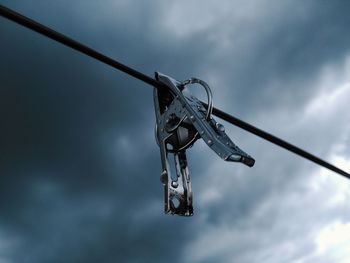 Low angle view of hanging against sky