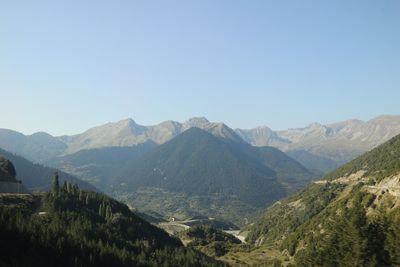 Scenic view of mountains against clear blue sky