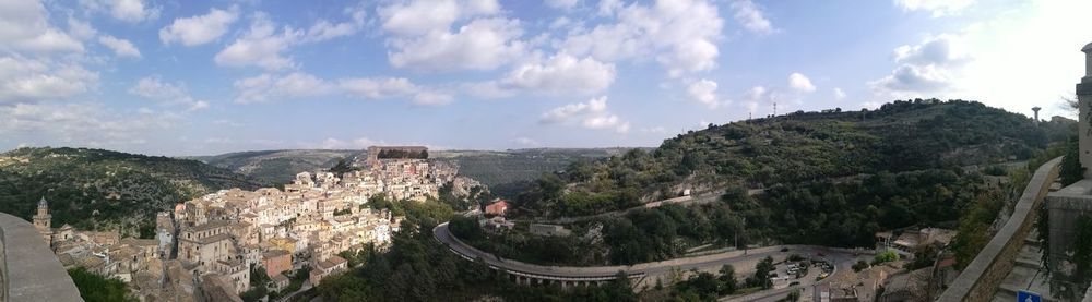 Panoramic view of castle on mountain against sky