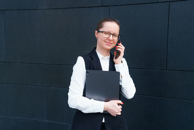 Successful businesswoman or manager, woman talking on mobile phone while