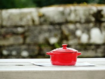 Red casserole on table