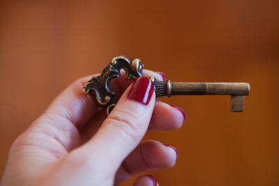 Close-up of hand holding ring