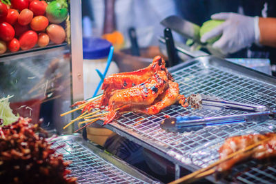 High angle view of people on barbecue grill