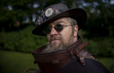 Portrait of man wearing sunglasses and hat