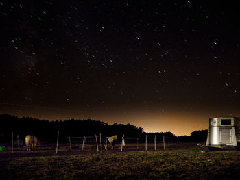 Scenic view of field against sky at night