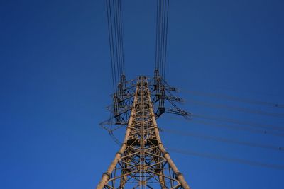 Low angle view of tree against clear blue sky