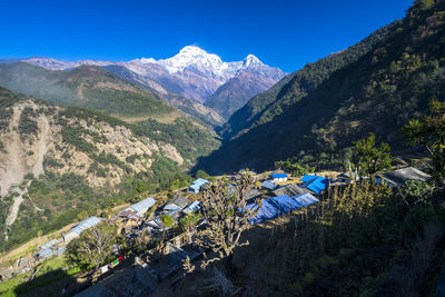 High angle view of mountains against blue sky