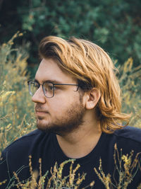 Portrait of a young guy in the grass