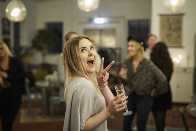 Woman with champagne glass during meeting in cafe