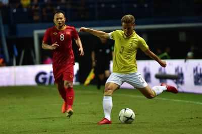 Full length of man playing soccer on field