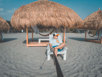 Full length of man on beach against sky