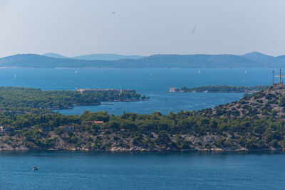 Scenic view of bay against clear sky