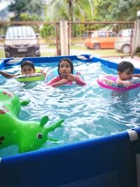 Portrait of children in swimming pool