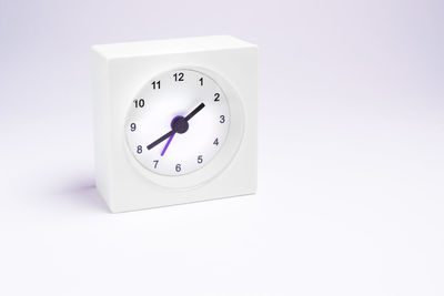 Close-up of clock on white background
