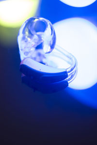 Close-up of blue glass on table