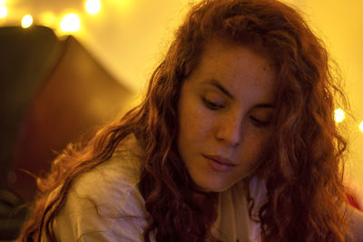 Portrait of beautiful young redhead woman with eyes closed