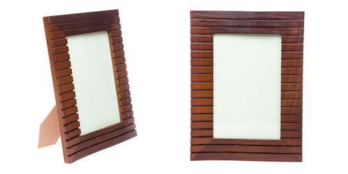 Directly above shot of wooden frame against white background