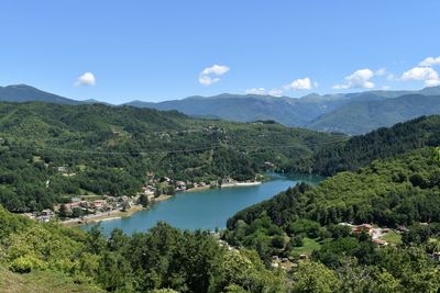 Scenic view of lake and mountains against sky