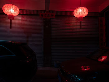 Illuminated lanterns hanging at night