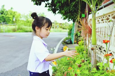 Girl standing flowers