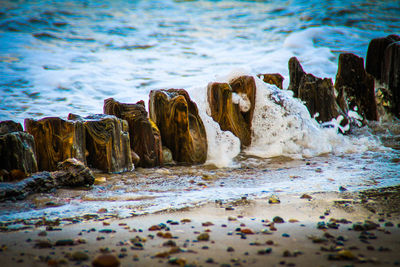 Rocks on beach by sea