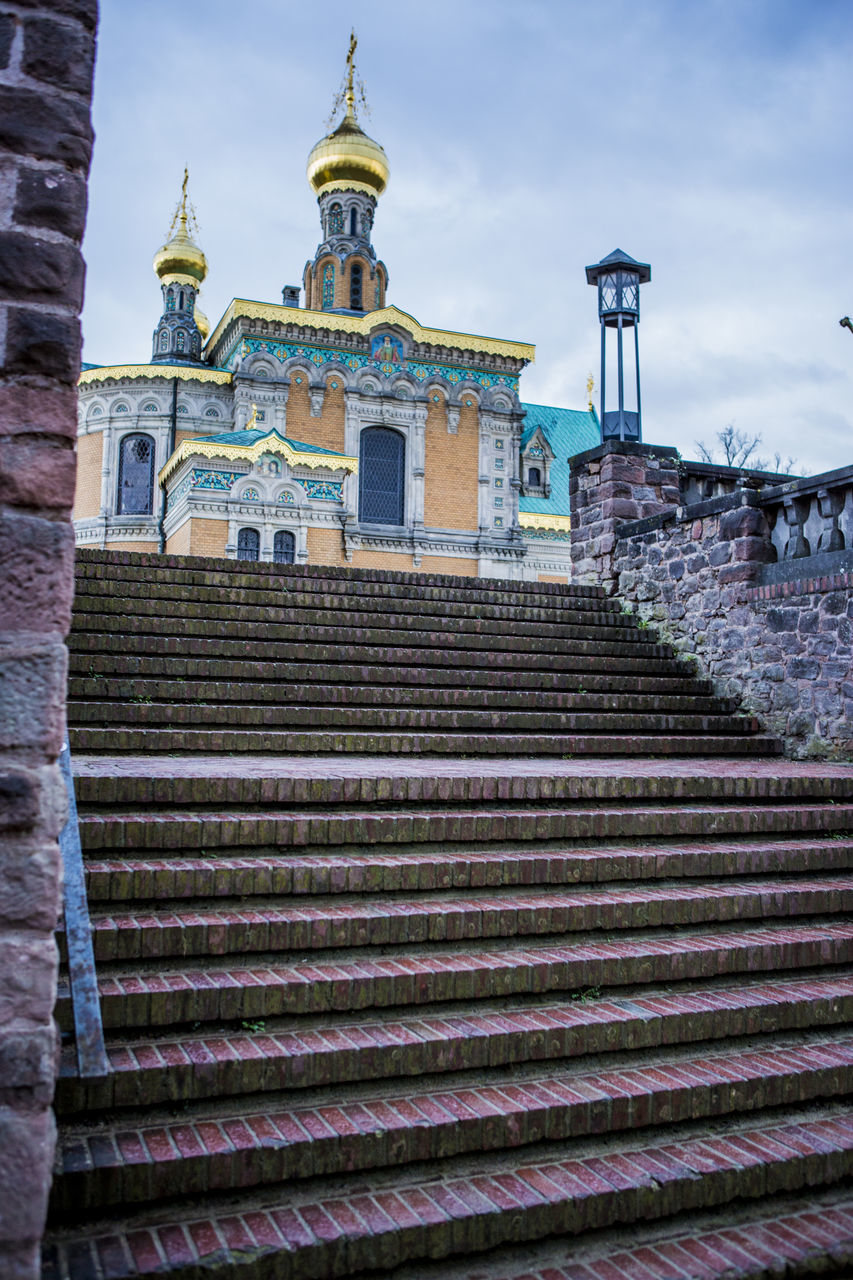 architecture, built structure, building exterior, building, sky, staircase, low angle view, religion, steps and staircases, belief, spirituality, nature, place of worship, travel destinations, cloud - sky, tower, the past, travel, no people, outdoors, architectural column, roof tile