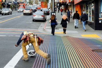 Woman standing on city street