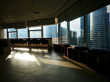 Empty chairs and tables in building