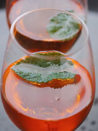 Close-up of aperol spritz served in glass on table