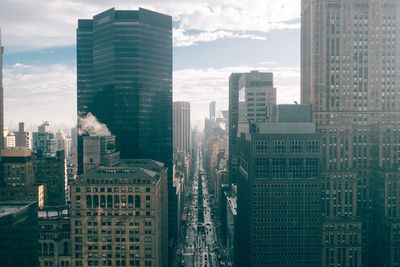 Skyscrapers in city against sky