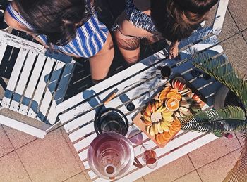 High angle view of women with fruits