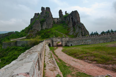 Scenic view of mountain against cloudy sky