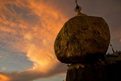 Low angle view of rock against sky