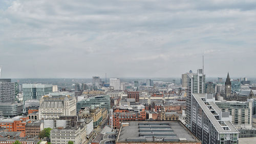 High angle view of buildings in city against sky