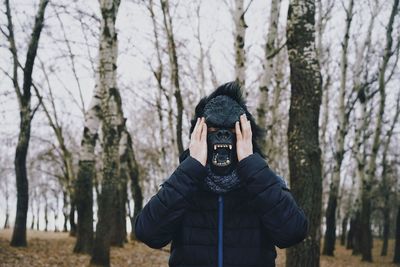 Person wearing mask in forest