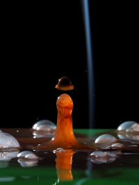 Close-up of water over black background