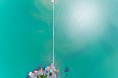 High angle view of sea against clear blue sky