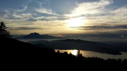 Scenic view of mountains against sky during sunset